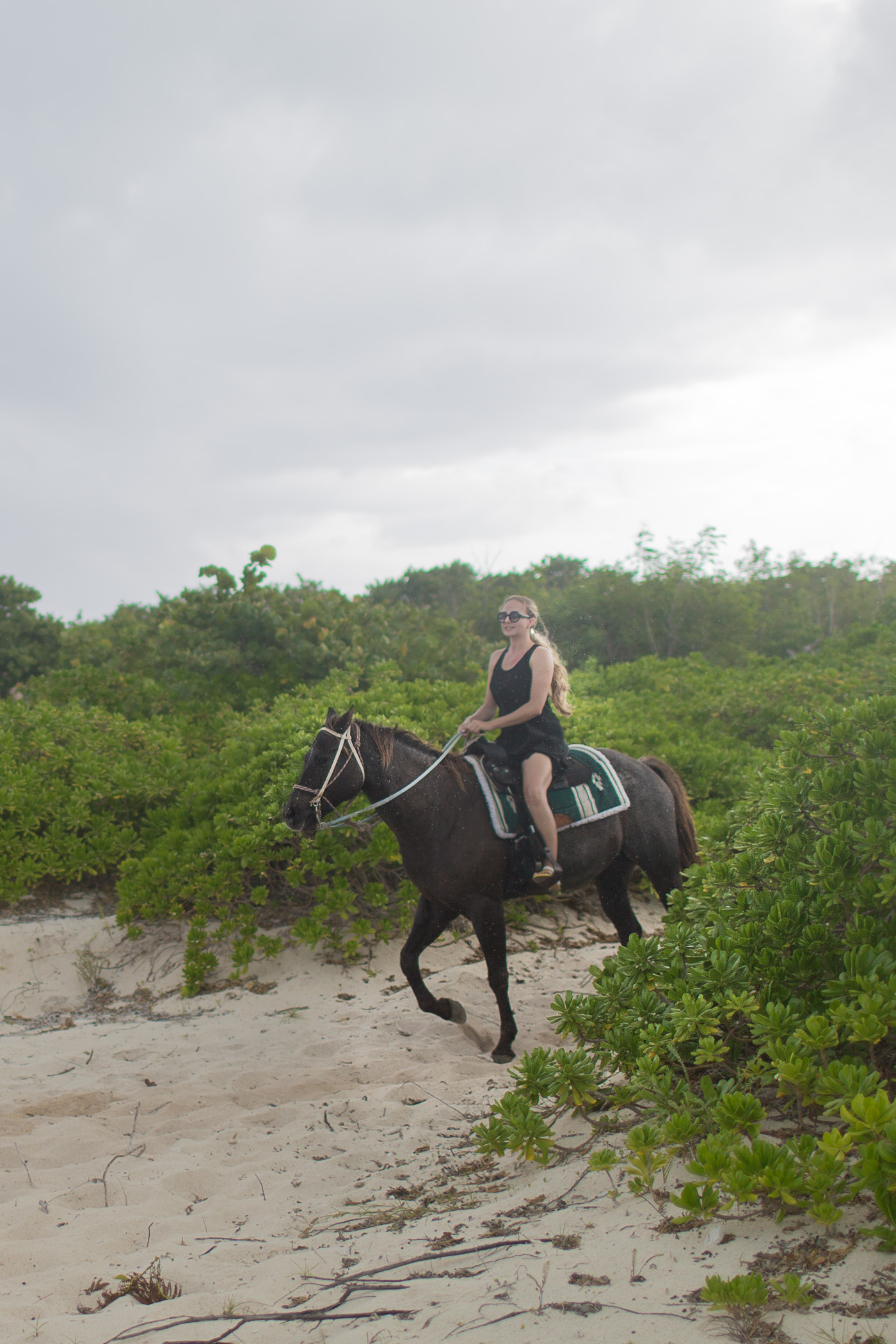 Riding horses on the beach in Grand Cayman