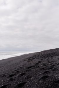 Black sand beach in Iceland, part of a Ring Road trip travel guide.
