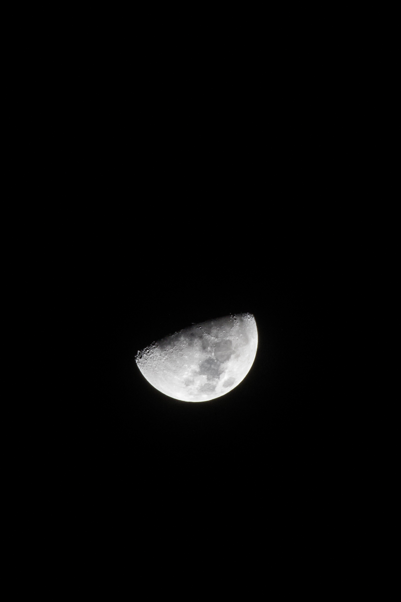 A half-full moon as seen from Little River, California
