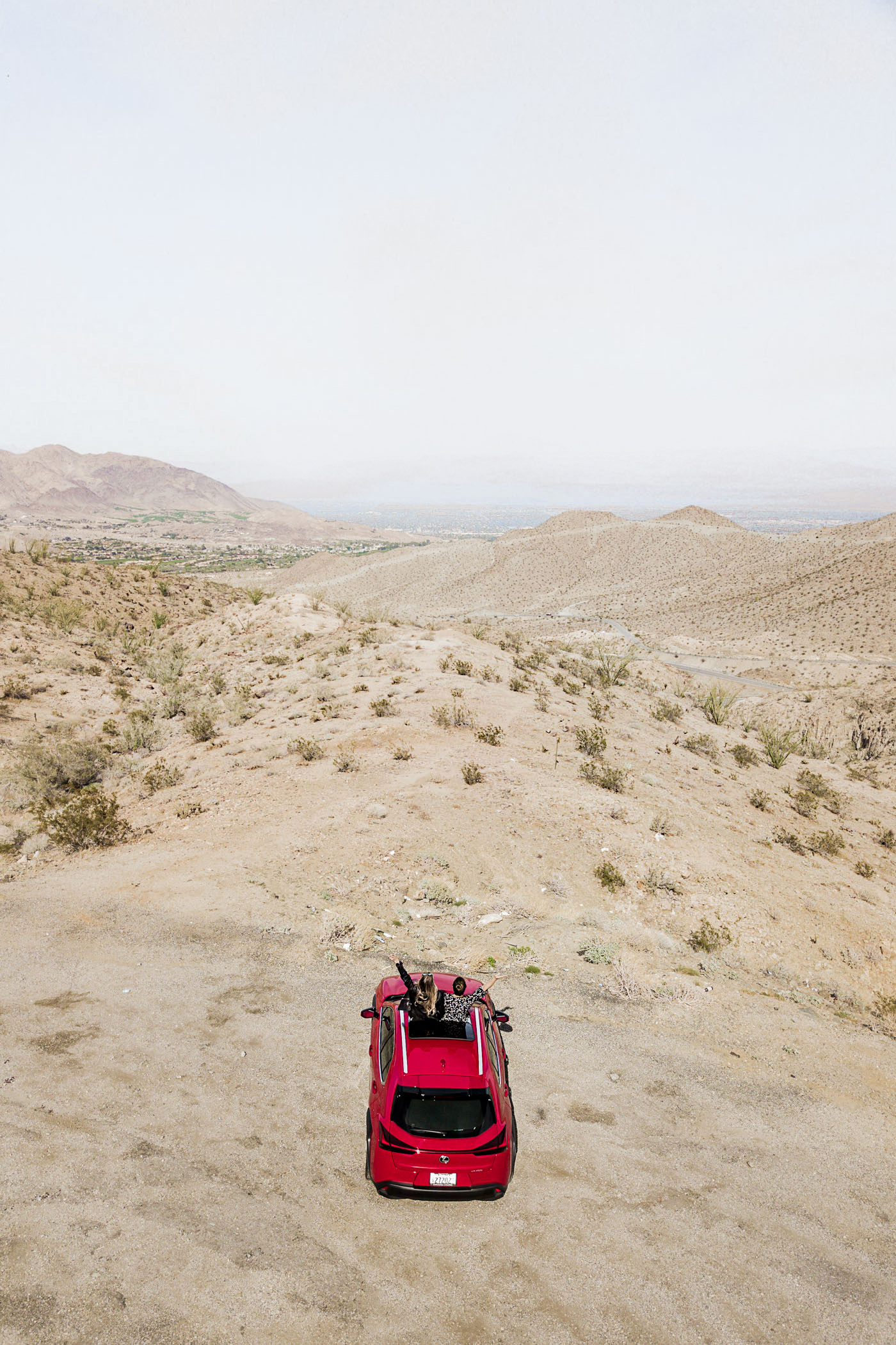 What to do for 3 days in Greater Palm Springs - Driving highway 74 in the Santa Rosa and San Jacinto Mountains National Monument featuring a red 2019 Lexus UX.